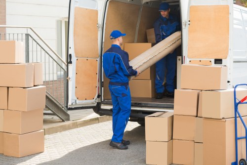 House movers helping a family move in Customhouse