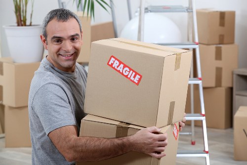Removals van service helping with a move in Customhouse