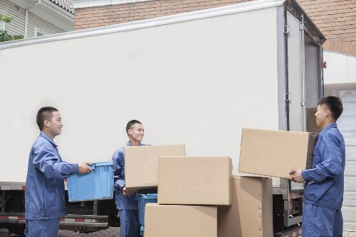 Removals van and packed household boxes for a Customhouse home move