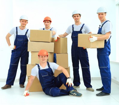 Team member safely loading boxes into a van