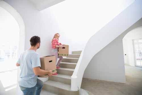 Professional movers handling office furniture in Customhouse